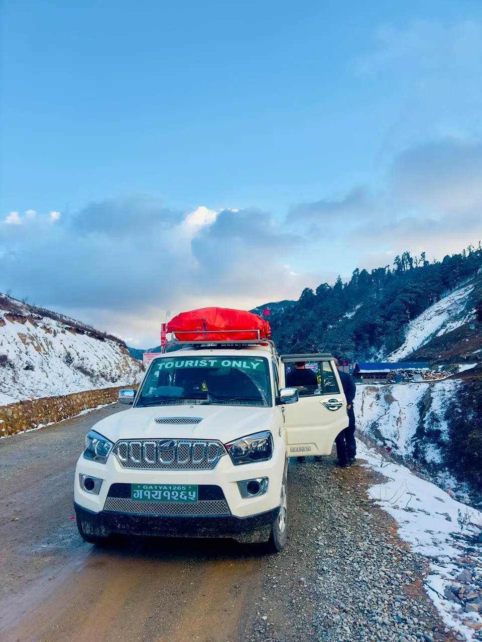 Scorpio jeep on the road up to Mustang in winter
